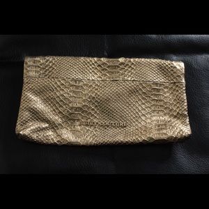 ‼️Sold‼️Gold Juicy Couture Faux Snake Print Clutch…
